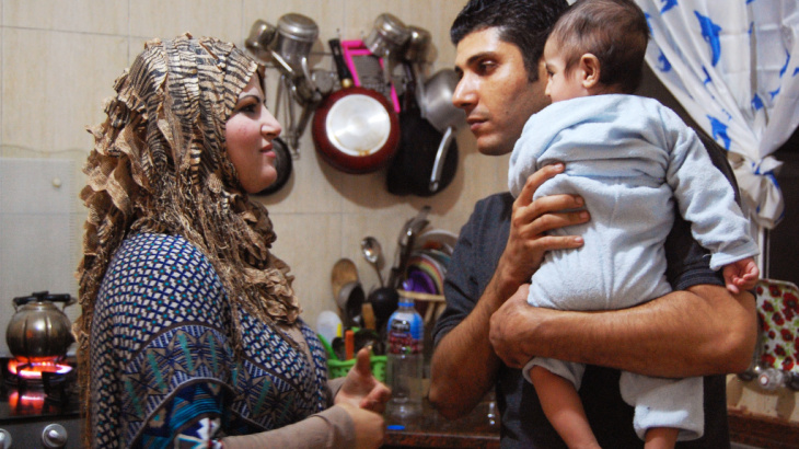 Ala'a Miqbel (shown here with his wife and their youngest son in their Gaza City apartment) was held for nearly four weeks in an Israeli prison, then released without charges. There, he met the "sparrows" — Palestinians who appear to be fellow prisoners b