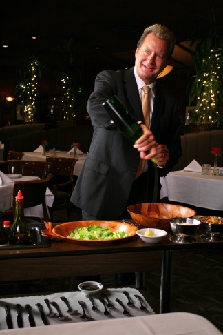 Dal Rae co-owner Lorin Smith preparing Caesar salad tableside