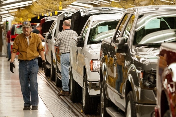 The Labor Department Wednesday reports that U.S. worker productivity grew a modest amount from January through March after having declined in the previous quarter. (Photo: Ford Motor Co. F-150 trucks move along the Kansas City, Mo. assembly line in May 2013. Photo by Kevin Anderson/Bloomberg via Getty Images).