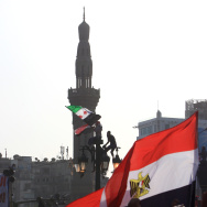 Egyptian wave their national flag as ten