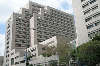 The “For Sale” sign is up on several California buildings - including the Ronald Reagan State Building in downtown LA, though it may feel like selling the living room furniture to cover the rent.