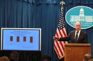 Governor Brown announced a balanced state budget that cuts spending by $12.5 billion and includes an eight to ten percent cut in take home pay for state employees and proposes a 'vast and historic' restructuring of government operations.