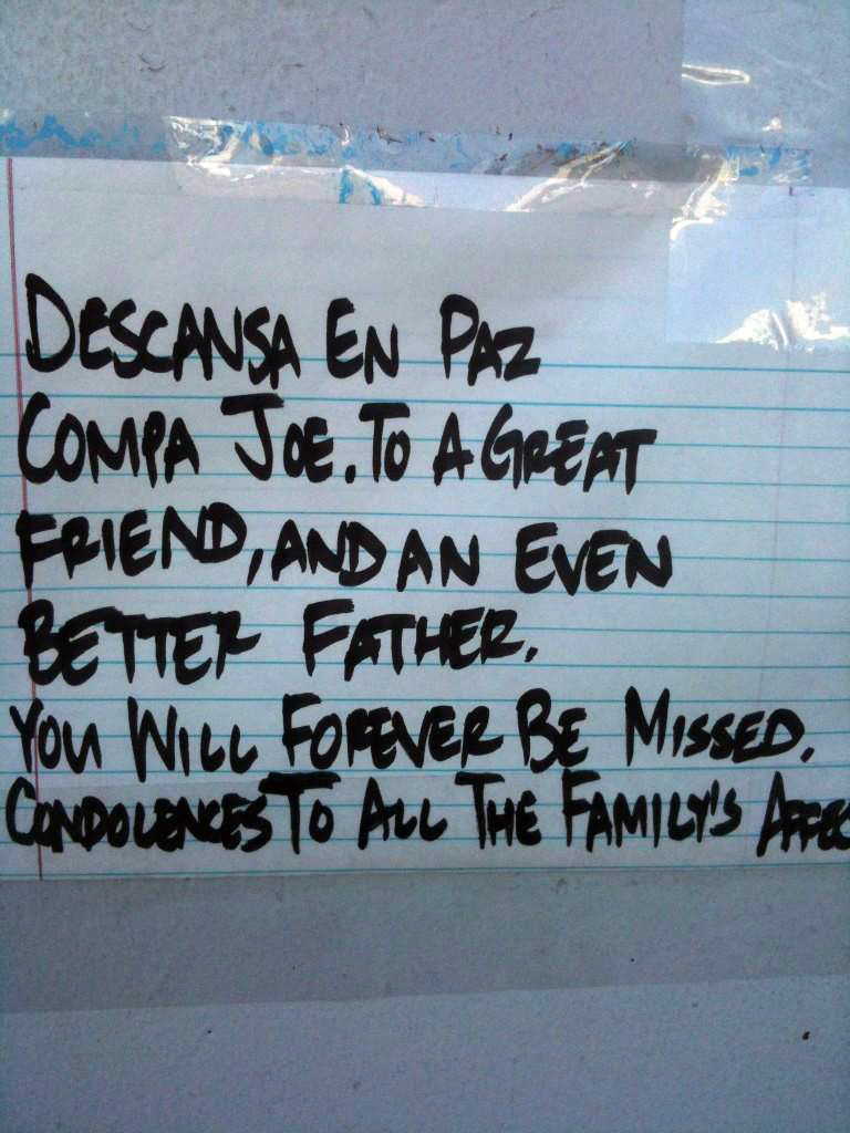 A note at the site of the Wednesday, Oct. 24, 2012 Downey shooting. "Descansa en Paz Compa Joe" for Josimar Rojas.