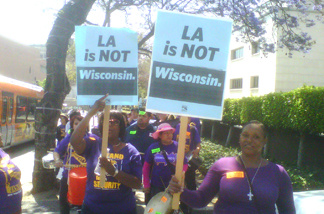 Carrying "L.A. is NOT Wisconsin'' signs and wearing purple T-shirts reading "Clean Up Sodexo," more than 200 workers protested today outside the Board of Supervisors' meeting against a county proposal to award $11.2 million in hospital janitorial contracts to a company that union leaders claim would cut staff by as much as 30 percent.