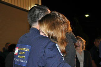 Mikael Gartner and girlfriend Laura Drost embrace after being apart for the longest amount of time in their one-year relationship, 16 days. Gartner was on the Urban Search and Rescue task force that deployed for Haiti on Jan. 13, 2010.