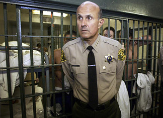 Los Angeles County Sheriff Lee Baca inside the Men's Central Jail at the Twin Towers Correctional Facility some years ago. During a session with reporters today he said he accepts an independent jail violence commission's conclusions that the institution needs major overhauls.