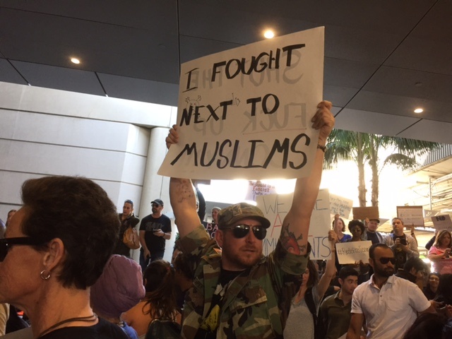 Protesters gathered at LAX on Sunday at Bradley International Terminal to protest President Trump's executive order temporarily banning migrants from 7 Muslim-majority countries.