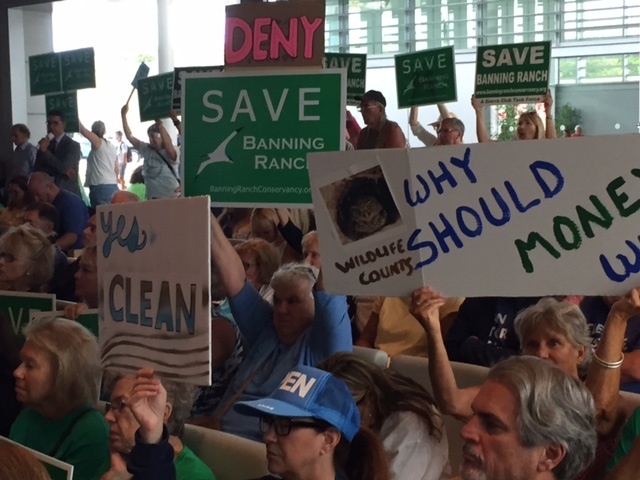 Protesters on Wednesday packed the Coastal Commission meeting, where commissioners voted to reject the controversial Newport Banning Ranch project.