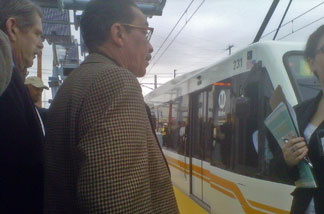 Los Angeles City Councilman Herb Wesson and other elected officials take a peek at the new Metro Expo light rail line. The service is scheduled to start running between downtown L.A. and Culver City starting later this year.