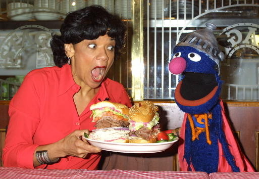 Actress Sonia Manzano, who plays Maria Rodriquez on the childrens television show "Sesame Street," and the muppet Grover