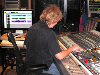 Charlie Paakkari works with a mixing board at Capitol Records' studios.