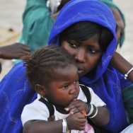 A women sits with her daughter
