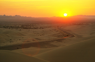 The sun rises over the Algodones Dunes, also known as the Imperial Dunes or American Sahara, on July 20, 2003 near Glamis, California in the Colorado Desert between Brawley, California and Yuma, Arizona.