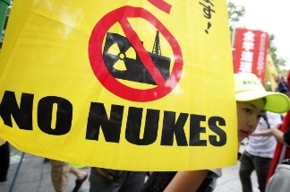 People take part in an anti-nuclear power protest on the 66th anniversary of the Hiroshima atomic bombing on August 6, 2011 in Hiroshima, Japan.
