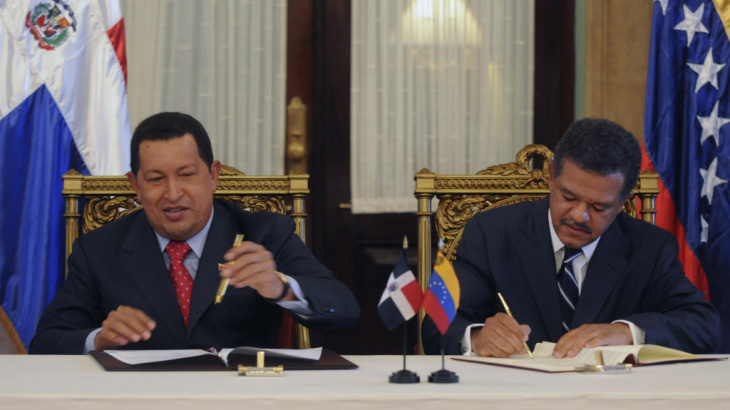 The Dominican Republic's President Leonel Fernandez, right, and Venezuela's President Hugo Chavez sign an agreement in 2010. The Dominican Republic gets about 40,000 barrels of oil a day from Venezuela.