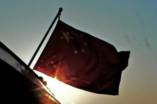 A Chinese flag flies over Xiamen Harbour, China.