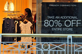 A woman shops at a store in a mall in Arlington, Virginia. The Commerce Department says retail sales ticked up 0.1 percent last month after a 0.5 percent rise in December. January's increase was the smallest in three months.Retail sales grew in December, but less than expected.