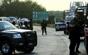 Mexican officers block the road between Reynosa on the U.S.-Mexico border and Monterrey, May 13, 2012