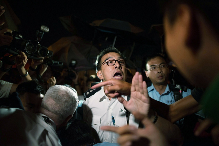Pro-democracy protesters with police in Hong Kong