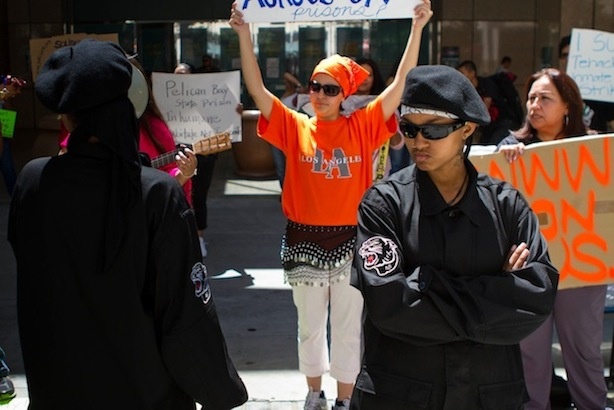 Nzinga Shakur, a member of the Black Riders Liberation Party, listens to speech during a rally in solidarity with prisoners conducting a hunger strike at detention facilities across California.