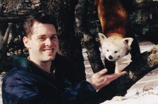 Jason Jacobs poses with a red panda at the Potawatomi Zoo in South Bend, Ind., in 2005. This was his first full-time zoo job. He started as education curator and became development director.