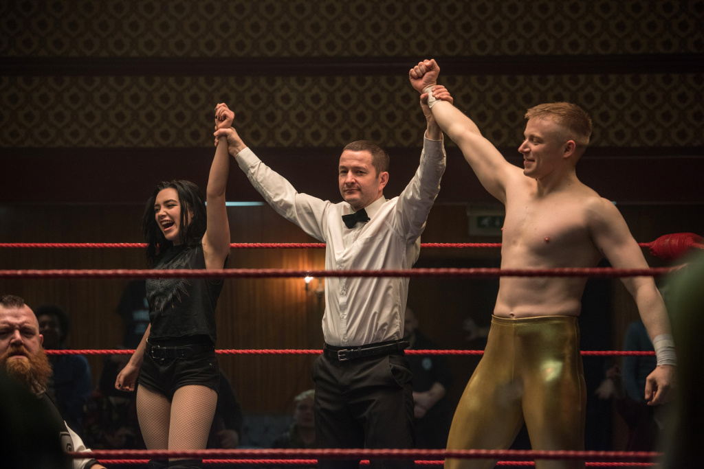 Florence Pugh (left) stars as Paige and Jack Lowden (right) stars as Zak Knight in FIGHTING WITH MY FAMILY. Florence Pugh (left) stars as Paige and Jack Lowden (right) stars as Zak Knight in FIGHTING WITH MY FAMILY.