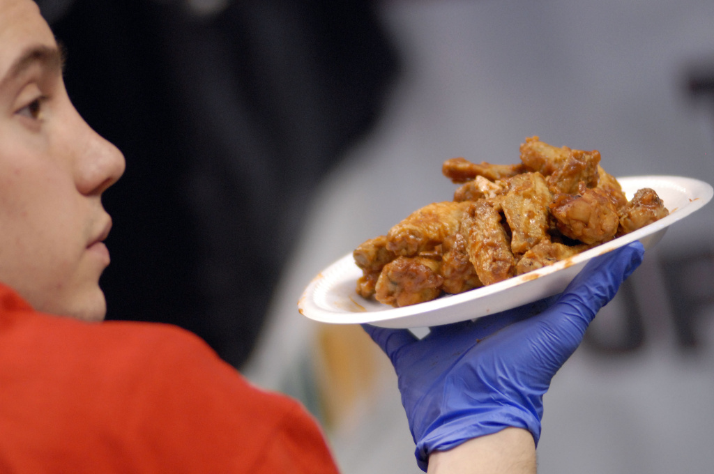 Philadelphia Hosts The 17th Annual Wing Bowl A staffer holds wings for contestants during Wing Bowl 17 at the Wachovia Center January 30, 2009 in Philadelphia, Pennsylvania. Thousands attended the event to witness John