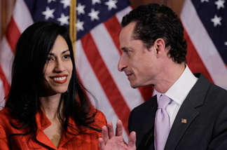 FILE - In this Jan. 5, 2011, file photo, Rep. Anthony Weiner, D-N.Y., and his wife, Huma Abedin, aide to Secretary of State Hillary Rodham Clinton, are pictured after a ceremonial swearing in of the 112th Congress on Capitol Hill in Washington.