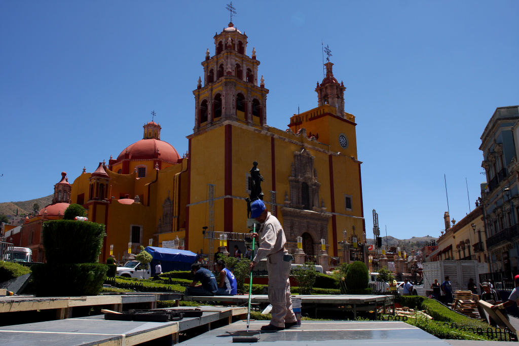 A worker paints the stage in front of t A worker paints the stage in front of the Guanajuato basilica for Pope Benedict XVI to use during his visit to Guanajuato, Mexico on March 22, 2012. Pope Benedict XVI will visit Mexico between March 23 and 26 on his first visit to the country.