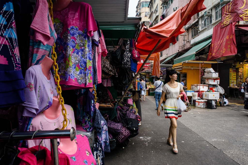 HONG KONG-LIFESTYLE-ECONOMY A woman walks past a street market stall in Hong Kong.