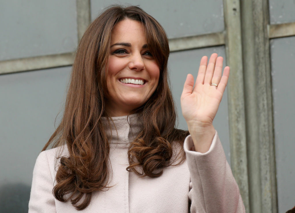 The Duke And Duchess Of Cambridge Make An Official Visit To Cambridge Catherine, Duchess of Cambridge smiles and waves to the crowds from the balcony of Cambridge Guildhall as she pays an official visit to Cambridge with Prince William, Duke of Cambridge on November 28, 2012 in Cambridge, England.