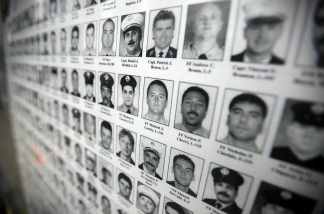 Mercer 20656 Photographs of firefighters killed on 9/11 are seen outside the World Trade Center site after the death of Osama bin Laden was announced May 2, 2011 in New York City.