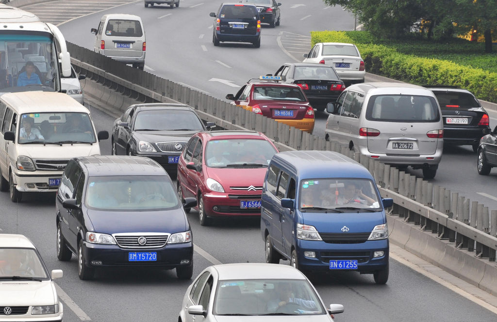 A General Motors Buick blue minivan (2/L A General Motors Buick blue minivan (2/L) is seen during morning rush hour traffic along Beijing's Second Ring Road on May 14, 2009.