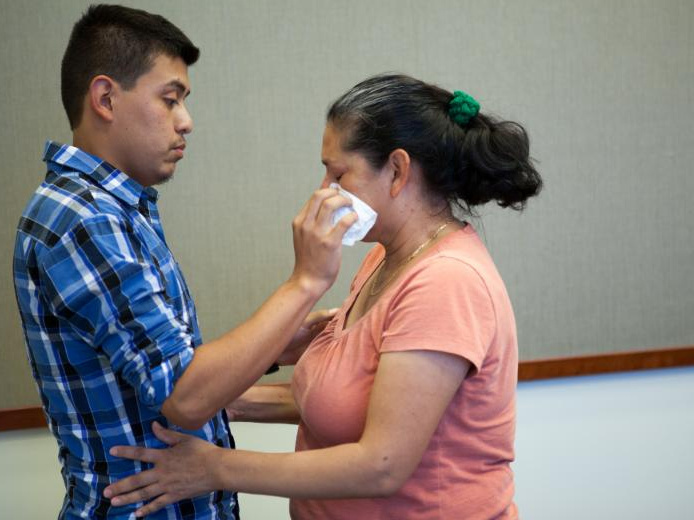 Steven Hernandez wipes a tear from his mother's eye after seeing her for the first time in 20 years in San Bernardino, Calif., on Thursday. Hernandez, 22, was abducted by his father in 1995 when he was 18 months old. Since that time, Maria Mancia, 42, had Steven Hernandez wipes a tear from his mother's eye after seeing her for the first time in 20 years in San Bernardino, Calif., on Thursday. Hernandez, 22, was abducted by his father in 1995 when he was 18 months old. Since that time, Maria Mancia, 42, had searched for her son to no avail.