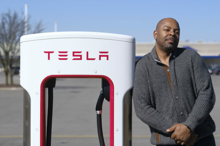_AJ53579 Roger Croney, a former Telsa employee, poses for a portrait at a Tesla charging station in Ft. Wayne, Ind. Thursday, March 22, 2018. (Photo by AJ Mast for The Center for Investigative Reporting)
