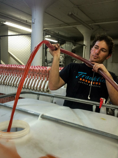 Anthony Caspary, co-founder and head distiller at Ventura Spirits, transfers freshly pressed strawberry juice into tanks until it's ready to be fermented and distilled into brandy or vodka. Anthony Caspary, co-founder and head distiller at Ventura Spirits, transfers freshly pressed strawberry juice into tanks until it's ready to be fermented and distilled into brandy or vodka.