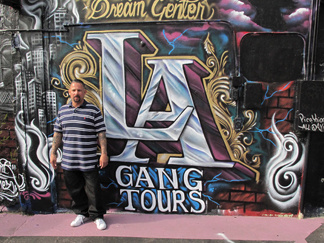 Alfred Lomas used to be in the Florencia 13 gang before he founded LA Gang Tours. Now, in addition to running the tours, Lomas also manages a mobile food bank.