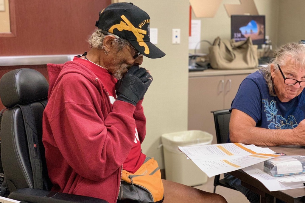Veteran Olaf Olson said he takes his harmonica with him everywhere he goes. He said just breathing into it improves his lung function. Veteran Olaf Olson said he takes his harmonica with him everywhere he goes. He said just breathing into it improves his lung function.