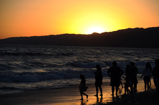 A family enjoys the beach near Los Angeles.