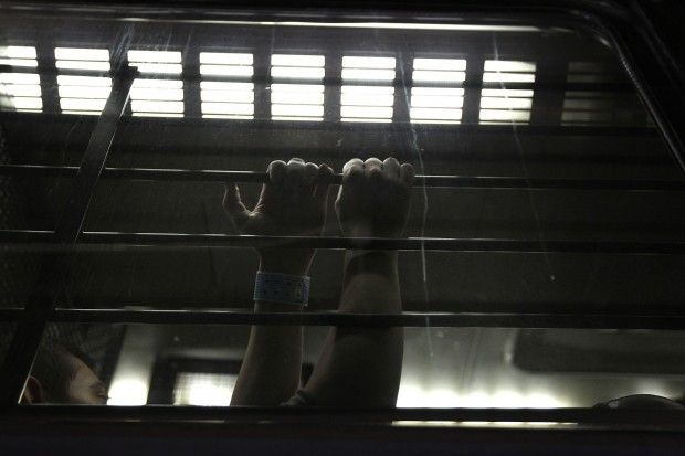 A man waits to be processed at a U.S. Immigration and Customs Enforcement detention facility in Arizona.