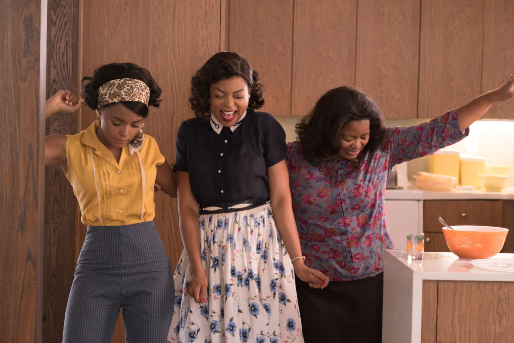 HIDDEN FIGURES Mary Jackson (Janelle Monae, left), Katherine Johnson (Taraji P. Henson) and Dorothy Vaughan (Octavia Spencer) celebrate their stunning achievements in one of the greatest operations in history.