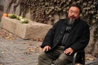 Chinese artist Ai Weiwei sits in the courtyard of his home in Beijing where he remains under house arrest on Nov. 7, 2010.