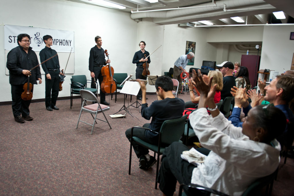 Robert Gupta/Street Symphony From left to right, Robert Gupta, Jin-Shan Dai, Jonathan Karoly, and Ben Ullery finish playing classical music on Skid Row.