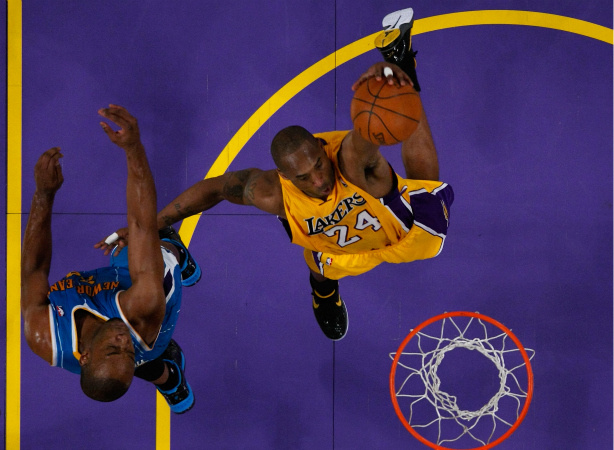 Mercer 17467 Kobe Bryant #24 of the Los Angeles Lakers dunks the ball with his left hand in the lane in the third quarter against the New Orleans Hornets in Game Five of the Western Conference Quarterfinals in the 2011 NBA Playoffs.