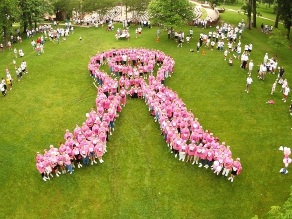 Breast cancer survivors stand to form the shape of a pink ribbon at a Susan G. Komen Foundation charity race in Tyler, Texas, in 2004. Breast cancer survivors stand to form the shape of a pink ribbon at a Susan G. Komen Foundation charity race in Tyler, Texas, in 2004.