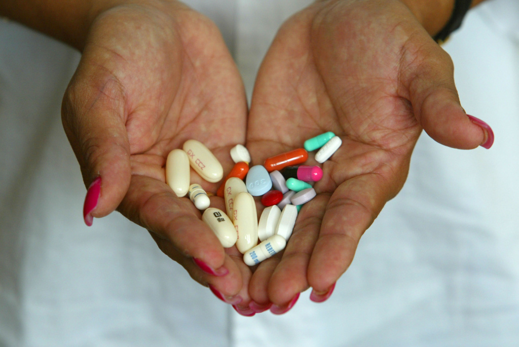 Alba Cerrato displays her cocktail of 14 different medications. Alba Cerrato displays her cocktail of 14 different AIDS medications that she takes three times a day July 11, 2002 in Miami, Florida. Cerrato contracted the disease in 1994 from her boyfriend who passed away in 1999. Centers for Disease Control and Prevention researchers have warned that HIV infection rates among women were on the rise. HIV-positive women of childbearing age between13 to 44 , soared from 80,000 to 135,000 from 1991 to 2000 in the U.S. The international conference on HIV/AIDs currently going on in Spain will discuss reducing the price of antiretroviral drugs so people in developing countries can have better access to treatment.