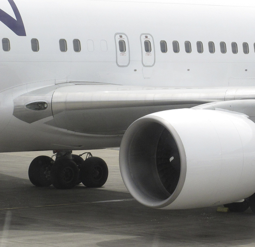 Hawaiian Airlines Flight 45 after its arrival on Monday at Maui's Kahului Airport. After the same flight landed on Sunday, a California teen emerged from the left rear wheel well.