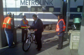 Metrolink workers greeted passengers at the Glendale station this morning to inform them of safety precautions. The new commuter rail express service begins May 9.