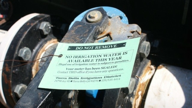 California Report The Terra Bella Irrigation District has put a physical seal on the spigots that deliver water to farmers. There is a $10,000 penalty for breaking the seal.