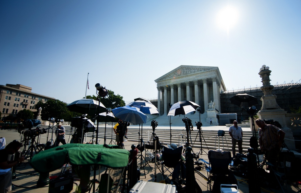 Members of the media camp outside the US Members of the media camp outside the US Supreme Court June 21, 2012, in Washington, DC as the Supreme Court is expected to hand down its ruling.